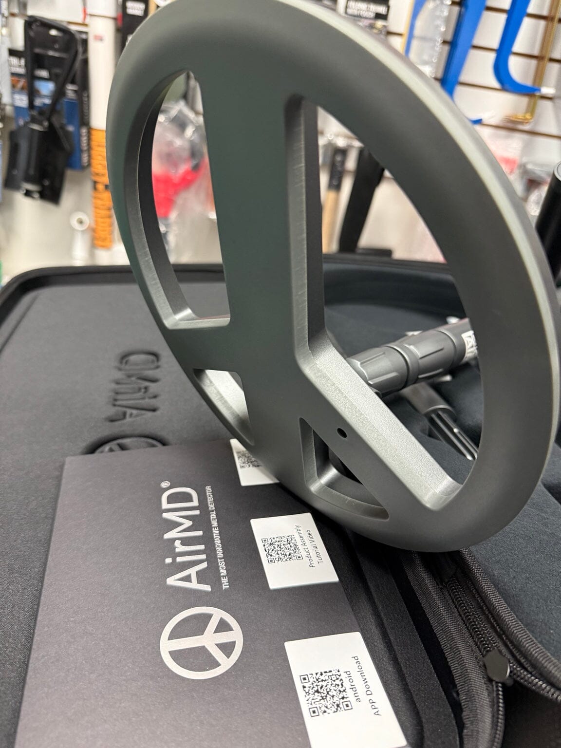 Close-up of AirMD metal detector search coil and documentation