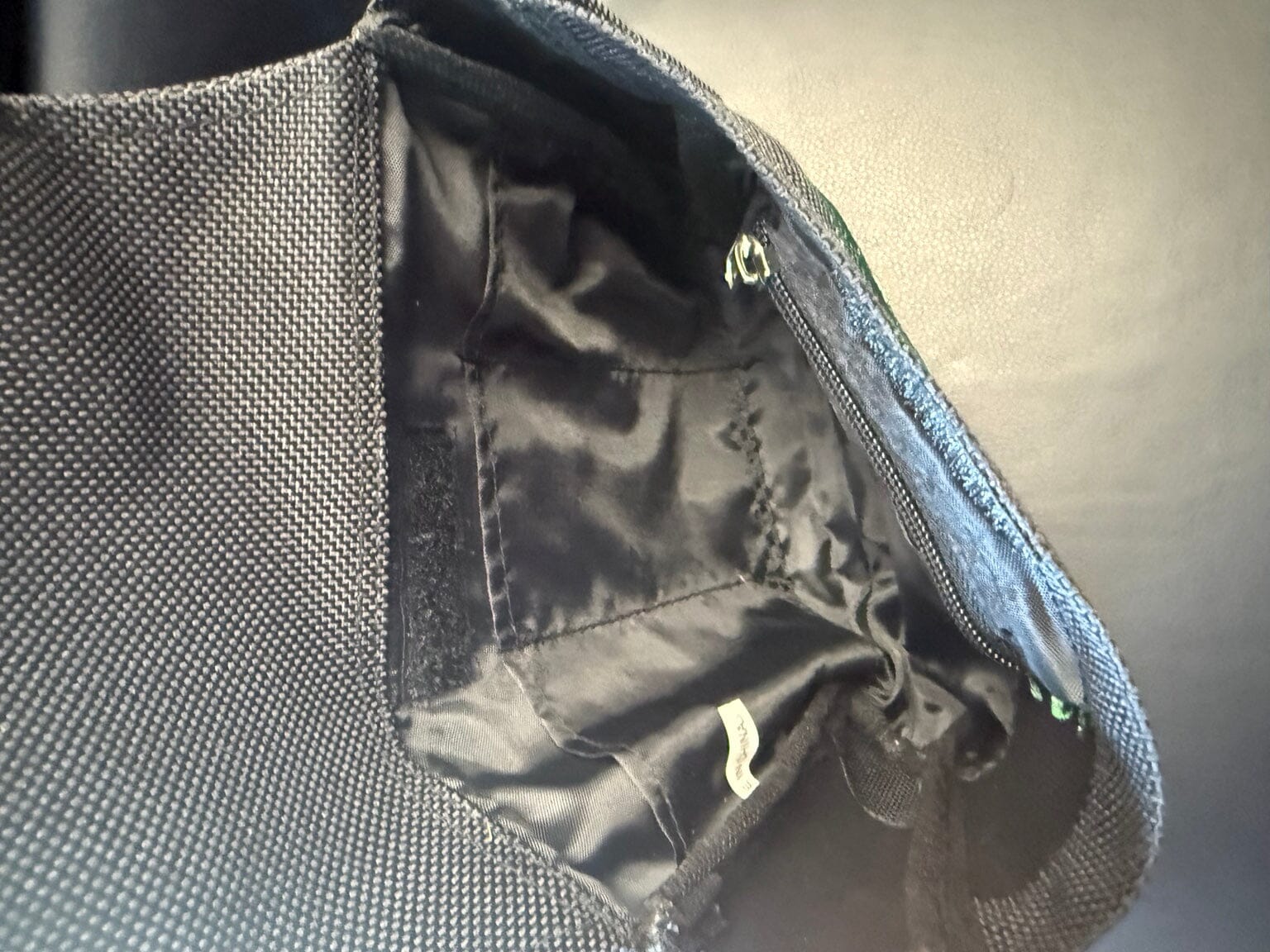 Interior of original Garrett metal detecting finds pouch showing zipper pocket and tool sleeves