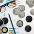 Collectible coin displayed in clear capsule with black insert