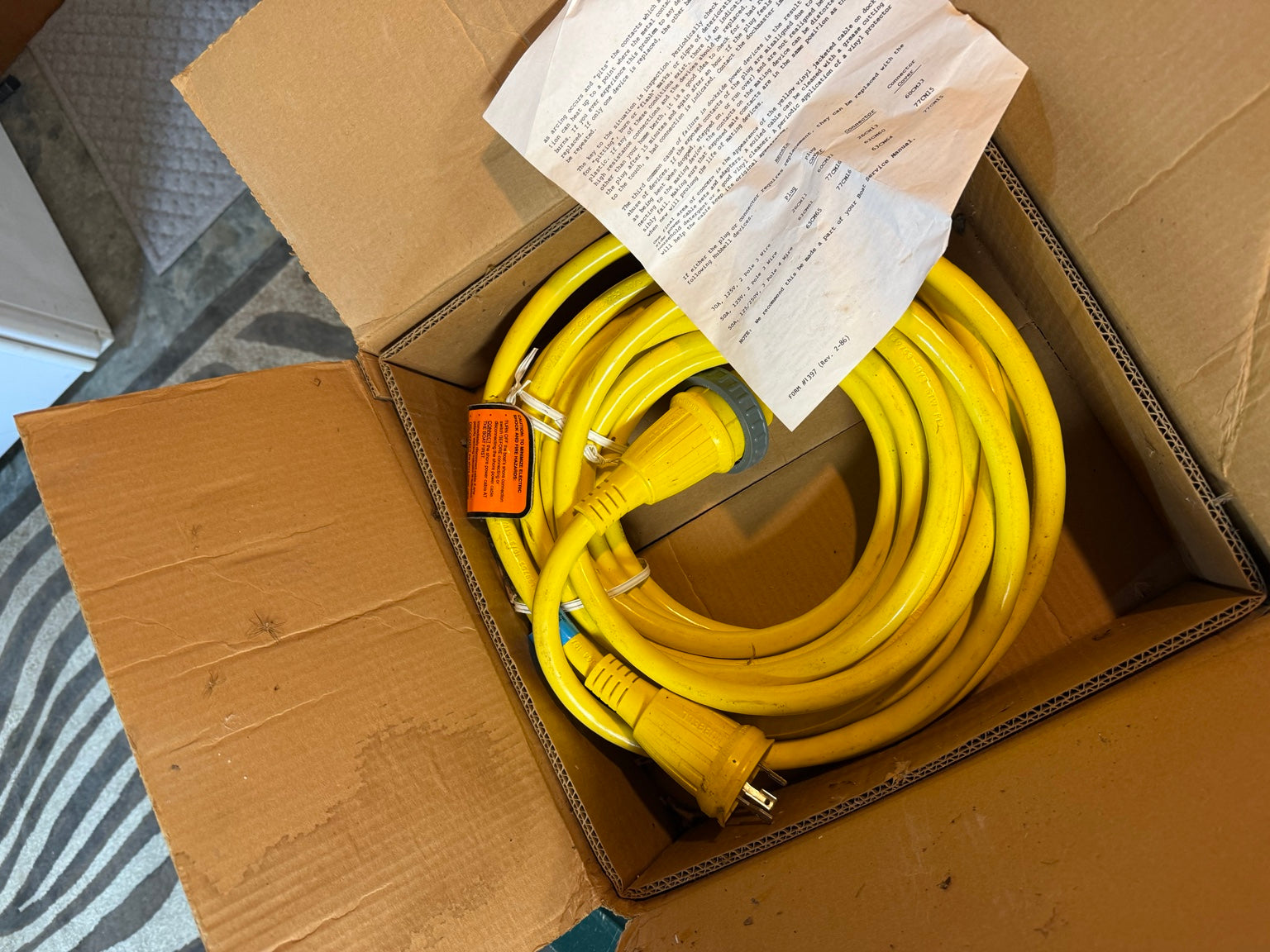 Unused Hubbell 50 foot 30A 125V yellow marine shore power cable in original box