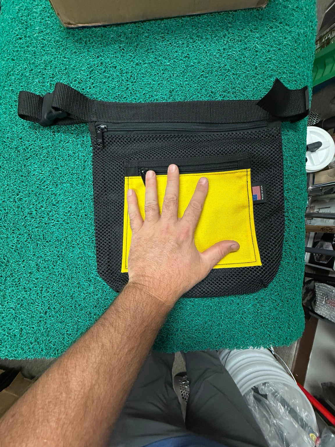 Large mesh dive recovery bag shown with hand for size reference