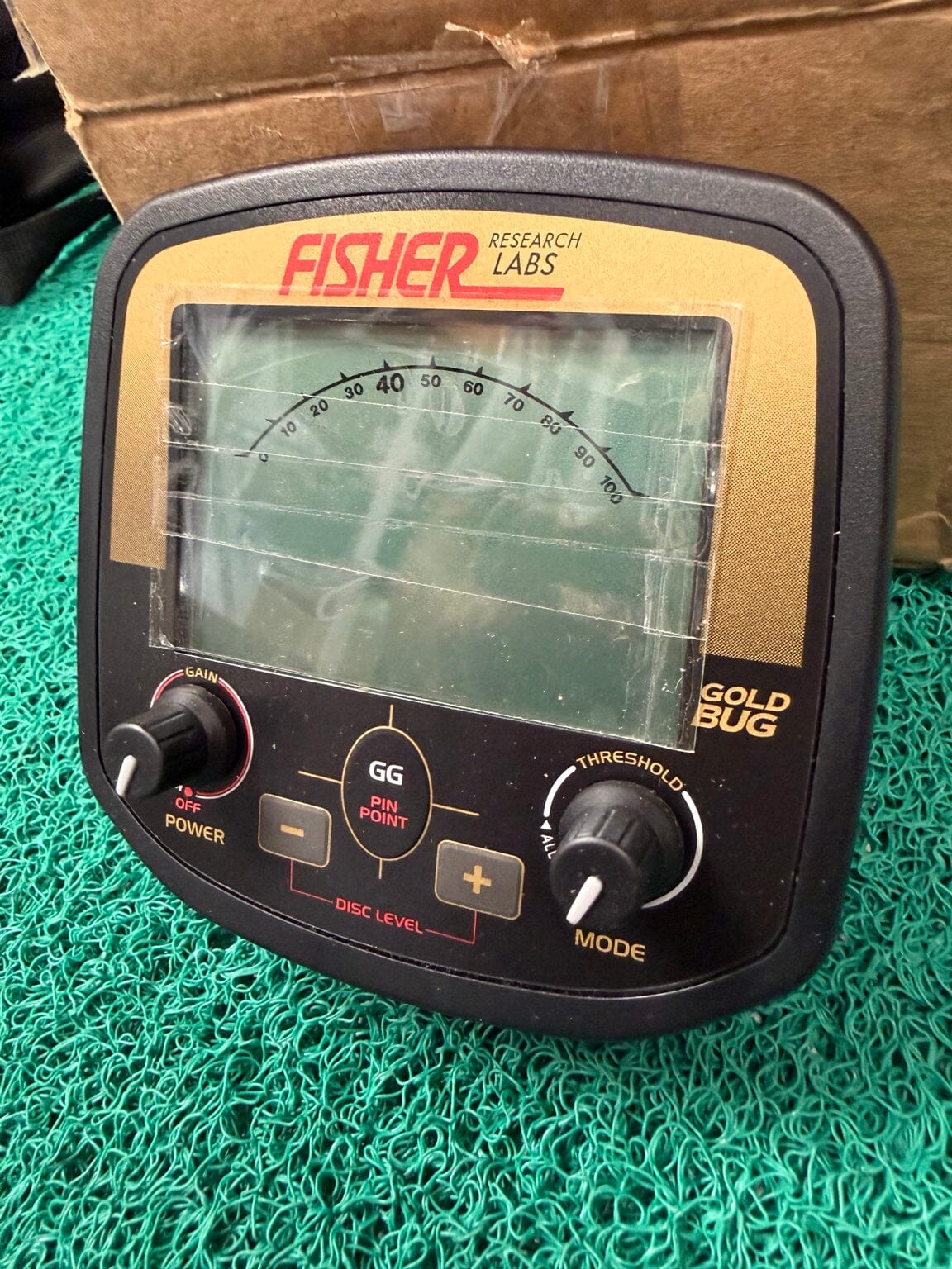 Used Fisher Gold Bug control housing showing face and controls