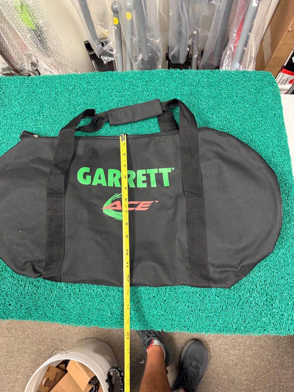 Garrett ACE carry bag shown with tape measure for height