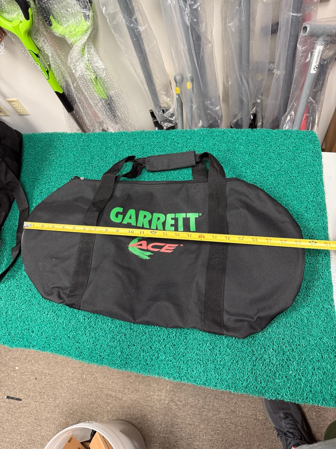 Garrett ACE carry bag shown with tape measure for length
