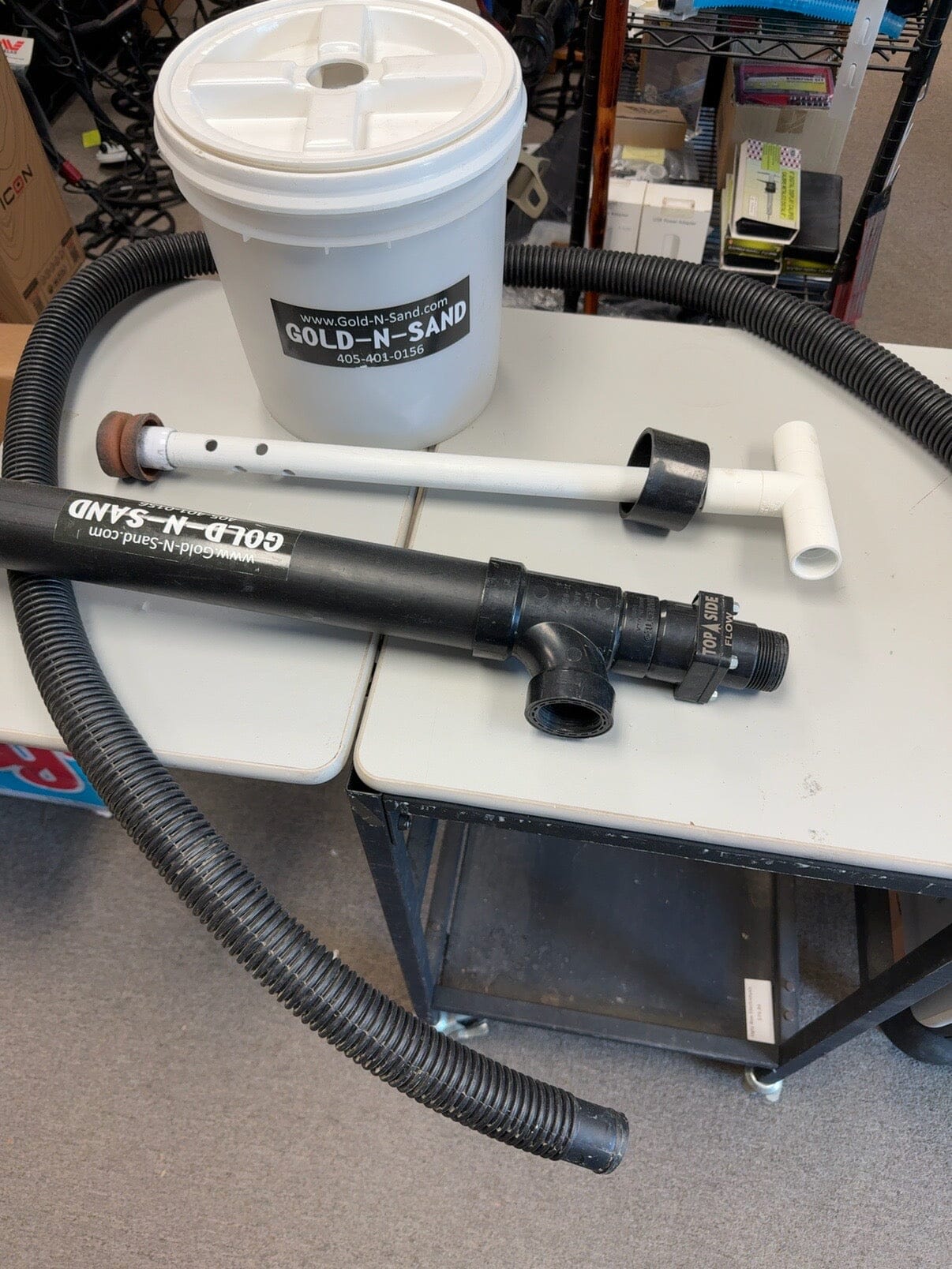 Slightly used Gold-N-Sand prospecting system with bucket hand pump hose and accessories