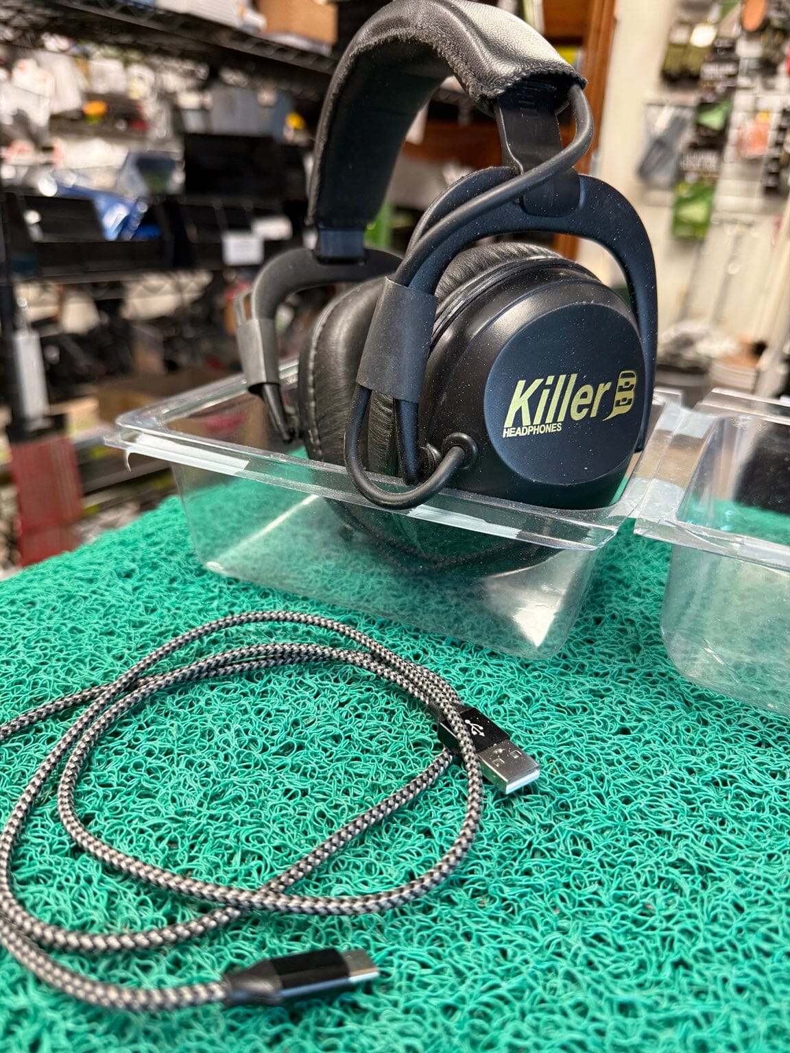 Actual used Killer B wireless headphones with included charging cable